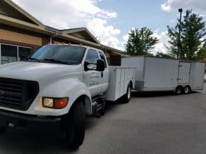 Doctor Sprinkler trucks at job.